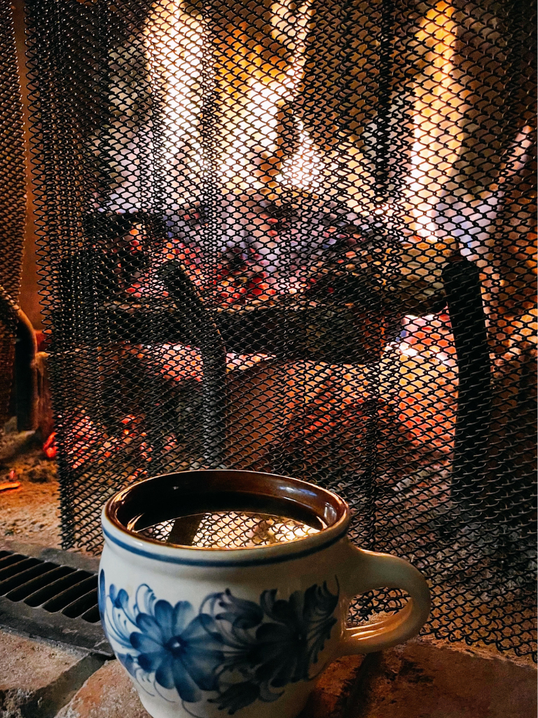 Retirees can Create a Cozy Fall by Enjoying a Cup of Coffee in Front of a Warm Fire