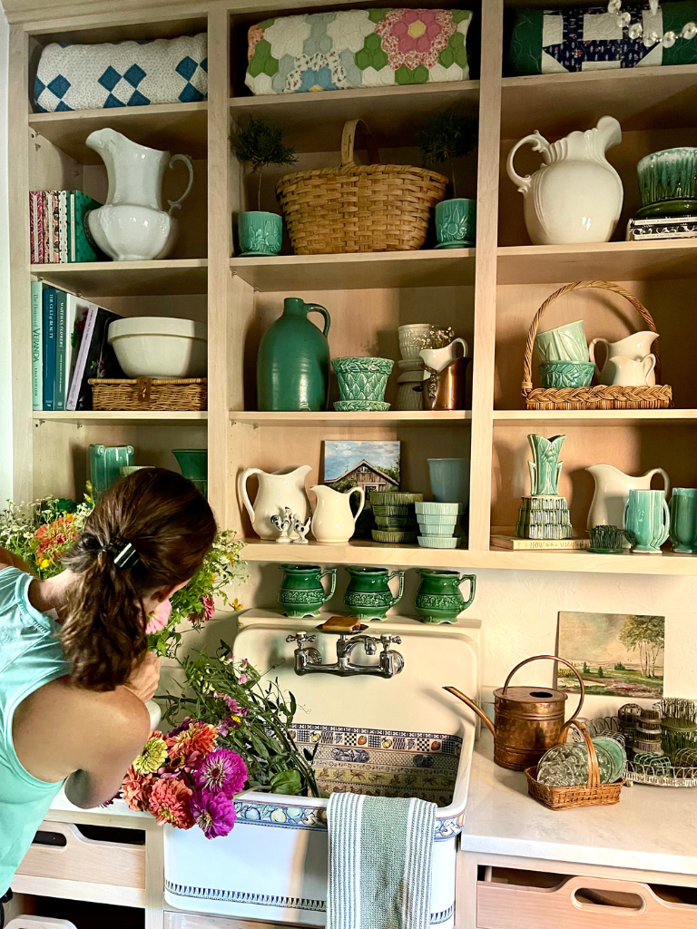 Our stylist, Lacey Howard, making adjustments in my flower room.